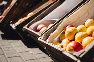Yellow and Red Apples in Crate