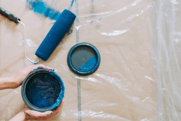 Blue Paint Beside Blue Paint Roller