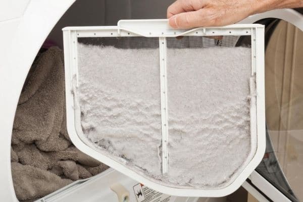 Person removing dryer lint