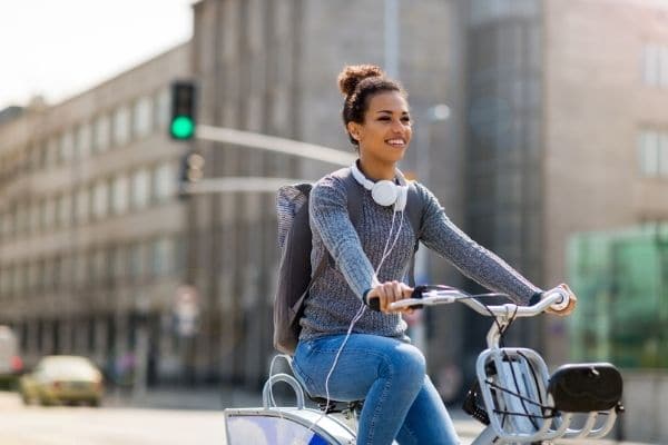 Woman Riding Bicycle prevents air pollution