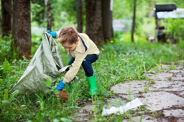 Why Sustainability is Important-child picking up trash