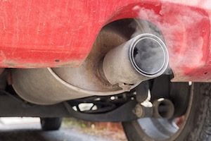 Red Car exhaust pipe pollution