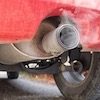Red Car exhaust pipe pollution