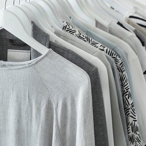 gray clothing on hanging rack